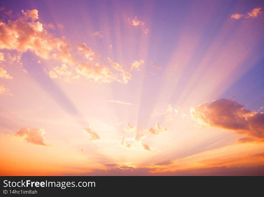 Beautiful sunset and clouds in the light of the setting sun