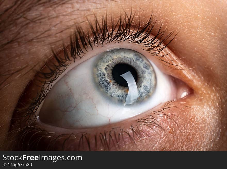 scared human eye closeup, fear symbol.
