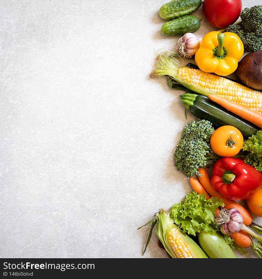Healthy food background. Healthy vegan vegetarian food. Fresh raw salad ingredients, vegetables tomatoes cucumbers lettuce pepper