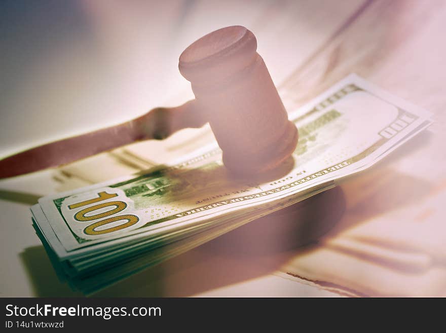 Hammer of a judge on a heap of dolor coins, a legal right, tinted, Hammer of a judge