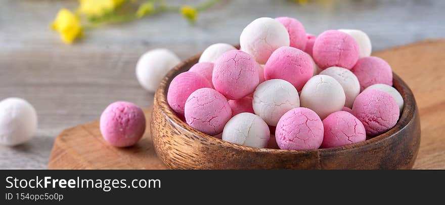Raw red and white tangyuan on wooden table background for Winter solstice food