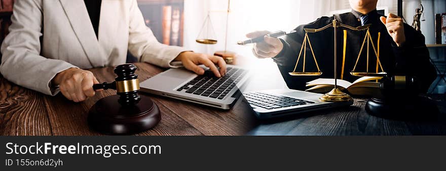 Lawyers discussing contract papers sitting in the table at office in the morning. concepts of law, advice, legal services