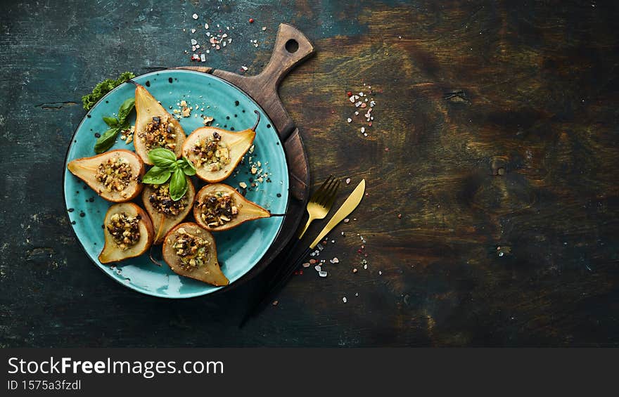 Ready-made dessert of baked pears, dor blue cheese, nuts and honey Restaurant menu.