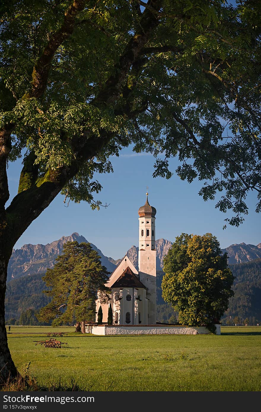 Beautiful autumn scenery with historic Saint Coloman Church in Alpine mountains in Bavaria, Germany. Beautiful autumn scenery with historic Saint Coloman Church in Alpine mountains in Bavaria, Germany