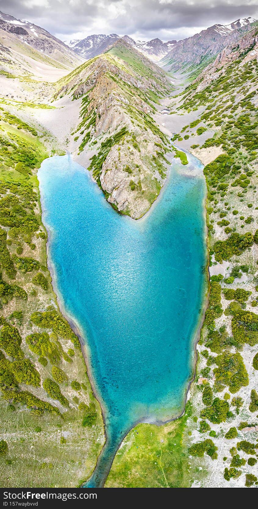 Heart shaped lake panorama top view