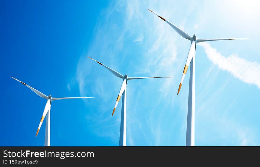 Wind power background - Blue cloudy sky with many windmill / wind turbines