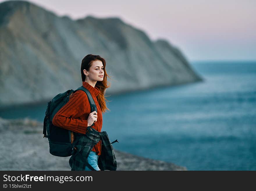 woman travels in nature backpack freedom landscape. High quality photo