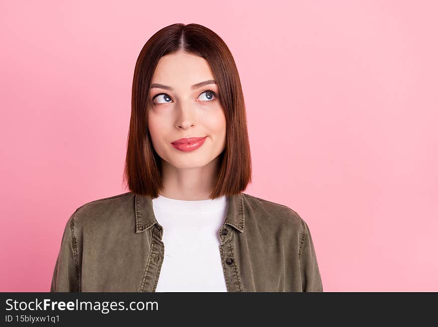 Photo of cute brunette hairdo millennial lady look empty space wear jeans shirt isolated on pink color background