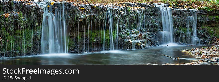 Large-format panorama with a small waterfall