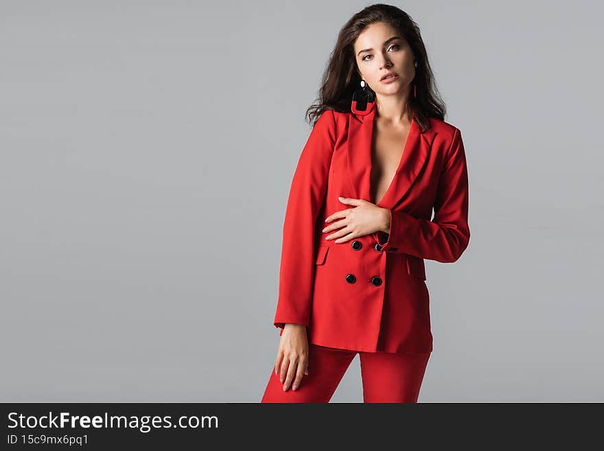 stylish young woman in red suit