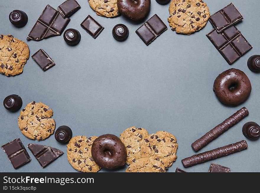 top view circular frame with chocolate candies. High quality photo