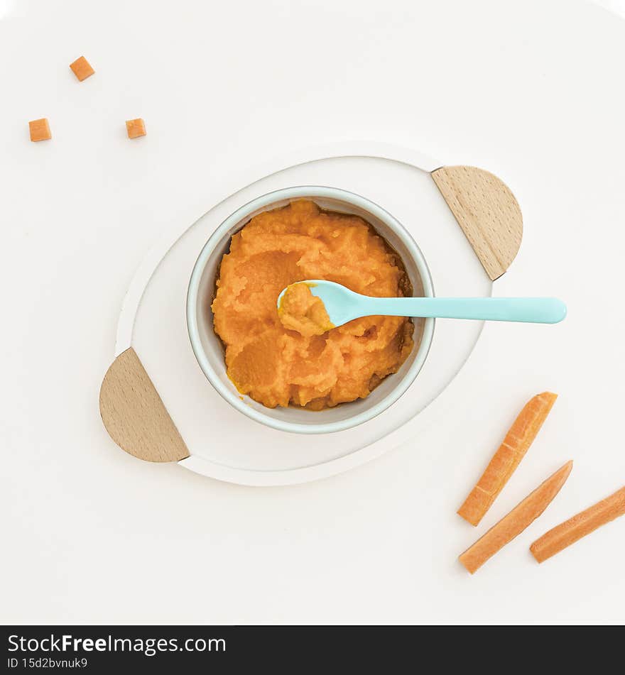 bowl with carrot baby puree. High quality photo