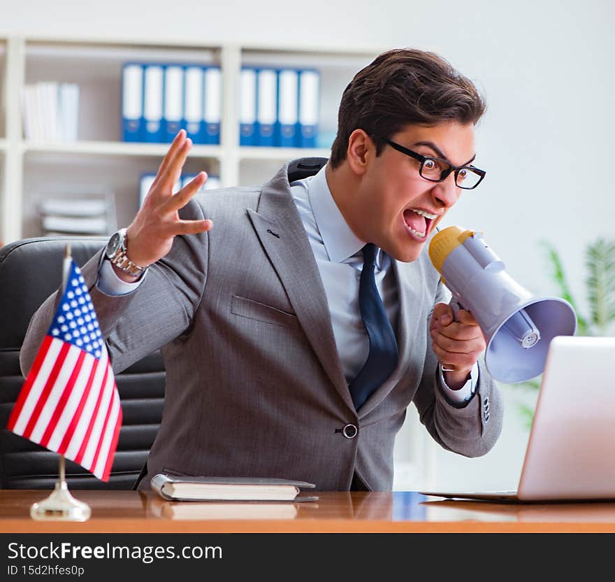 The businessman with american flag in office