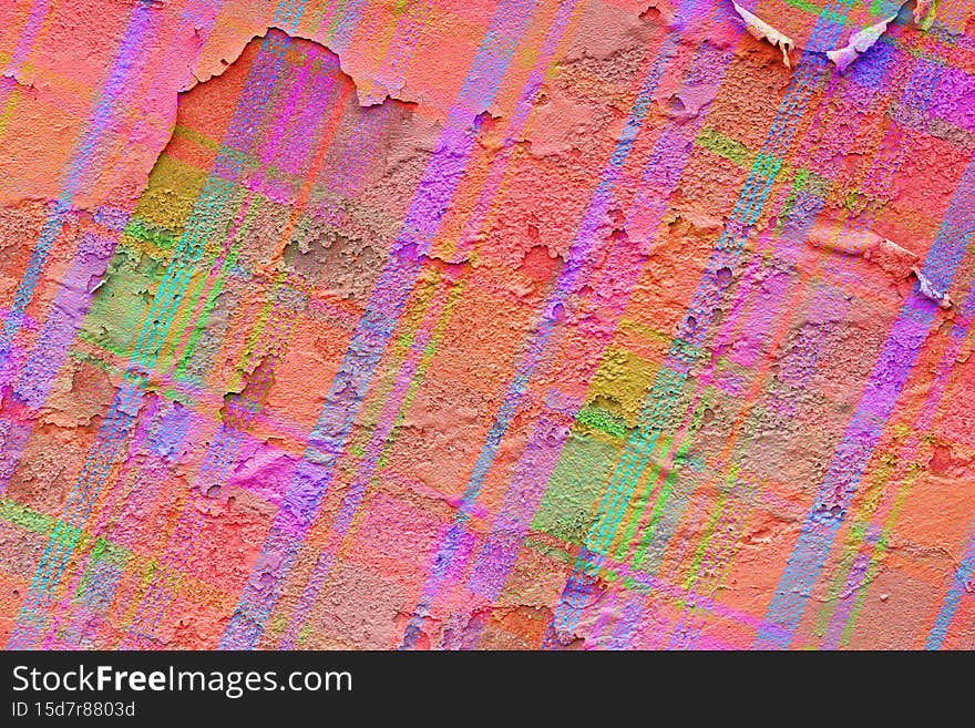 An old peeling wall painted in graffiti style with bold colors. An old peeling wall painted in graffiti style with bold colors