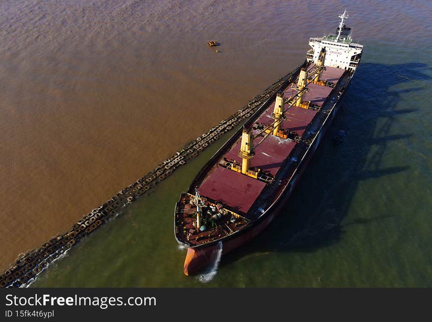 Glory Future, a bulk carrier, bulker, cargo ship, aground near the shore of the South East Asia