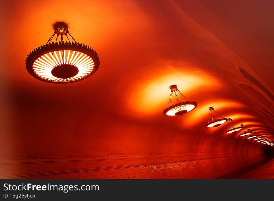 Diagonal orange lamps in metro background hd