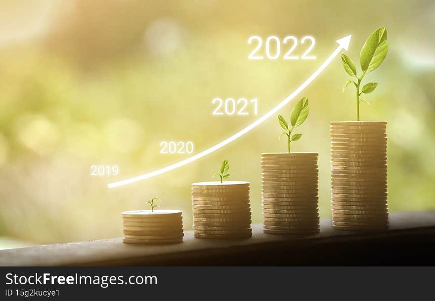 Growing growth year 2019 to 2022. Business graph with arrow up. Growing money coins stack. Saving money investment