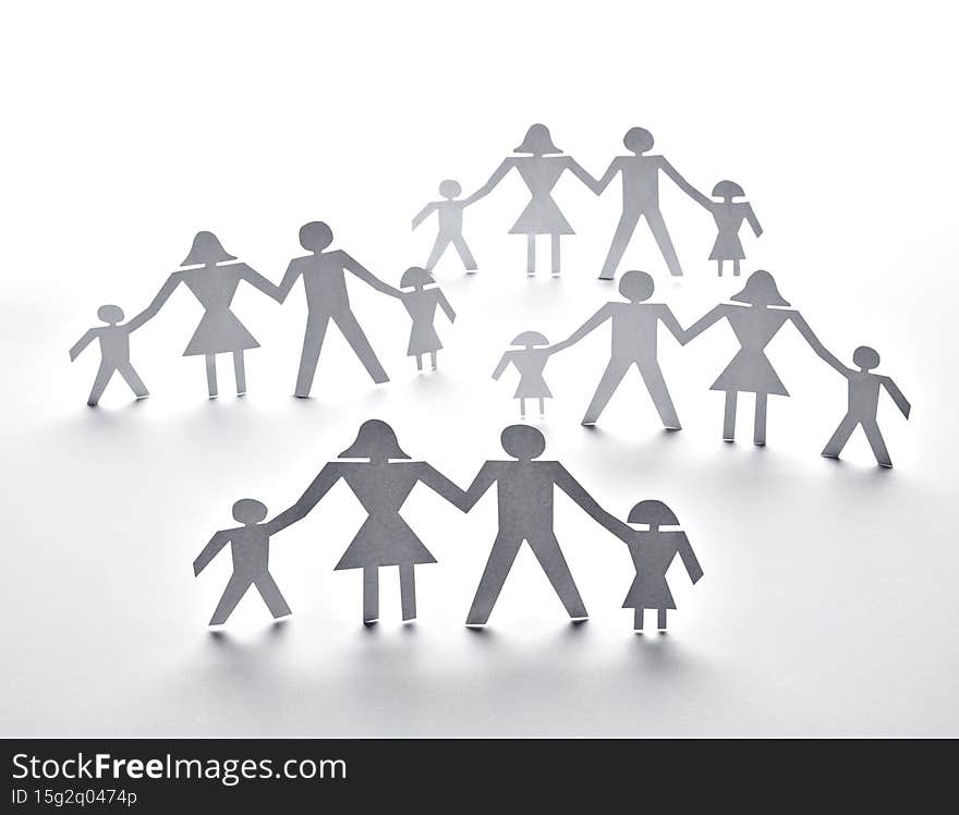 close up of paper people on white background. close up of paper people on white background