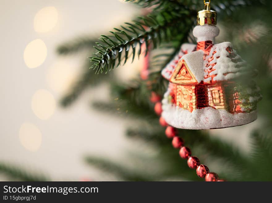Christmas bauble on Christmas tree with lights bokeh background