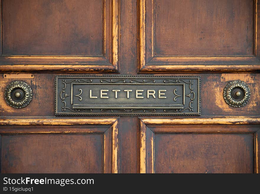old wooden door with letter box