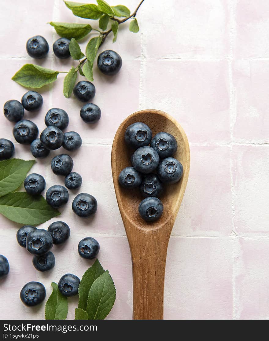Blueberries on tile background