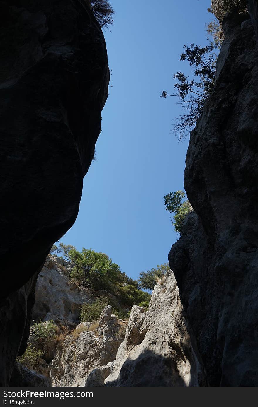 Magnificent mountainous landscape in the vicinity of the parched riverbed of the Loutani river. Kolympia, Rhodes, Greece