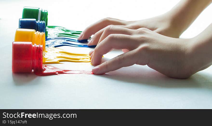 Paints flowing out of the jar