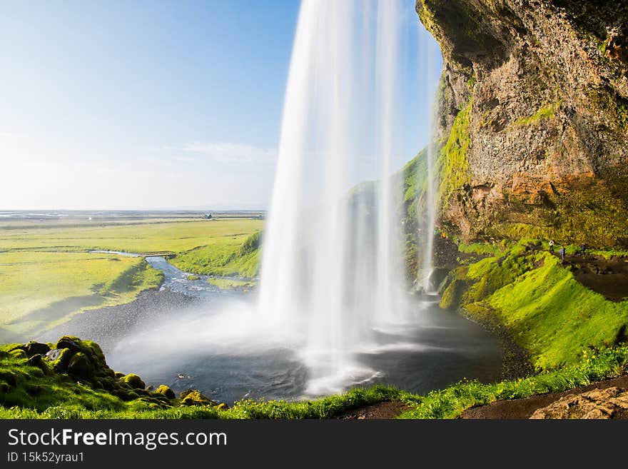 The beautiful waterfall of Seljalandsfoss in south Iceland on a sunny summer day