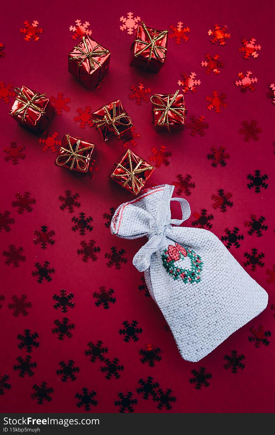 Christmas flat lay gifts and 2022 numbers on a red background