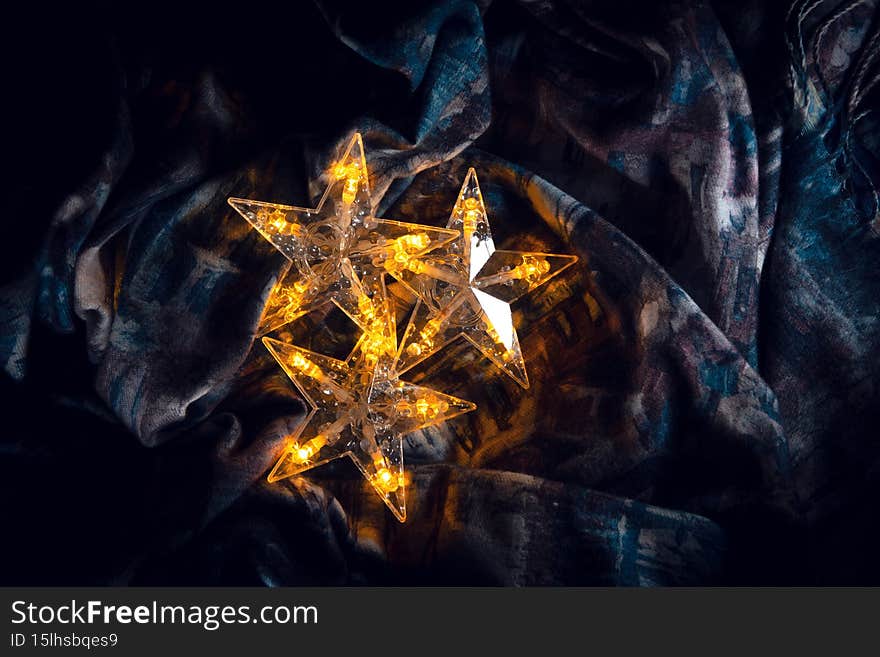 Three shining stars sparkle, creating a festive mood.