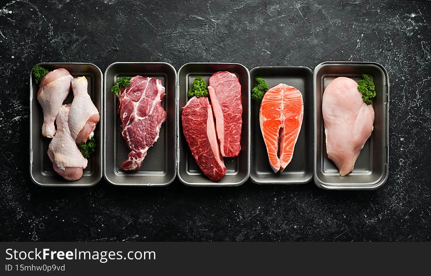 Set of fresh raw meat and fish in plastic boxes: veal, salmon steak, chicken, pork. Banner for the supermarket.