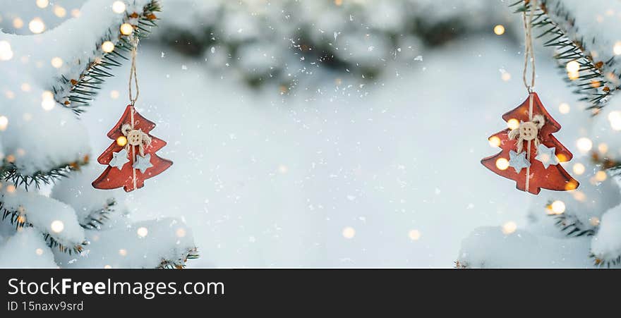 Christmas New Year Holiday Banner with copy space. Pine tree with red wooden toy and bokeh lights