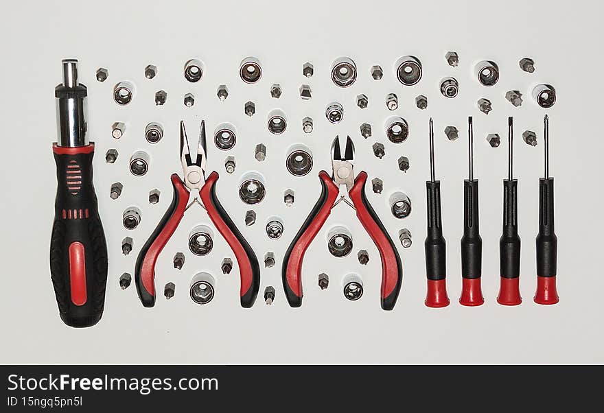 An open cardboard box on a light background. Repair, construction, tools. An open cardboard box on a light background. Repair, construction, tools.