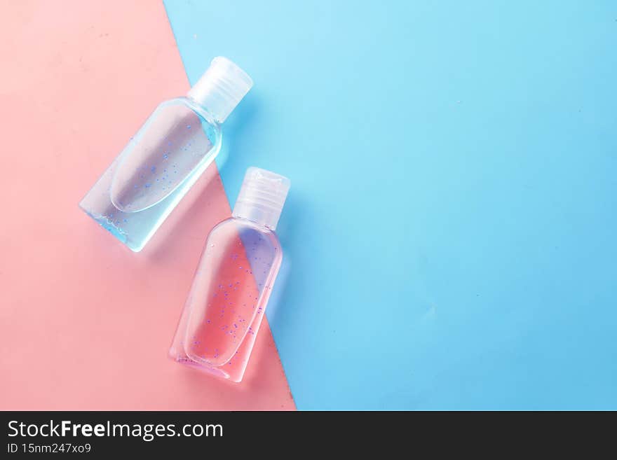 hand sanitizer liquid in a plastic bottle on color background .
