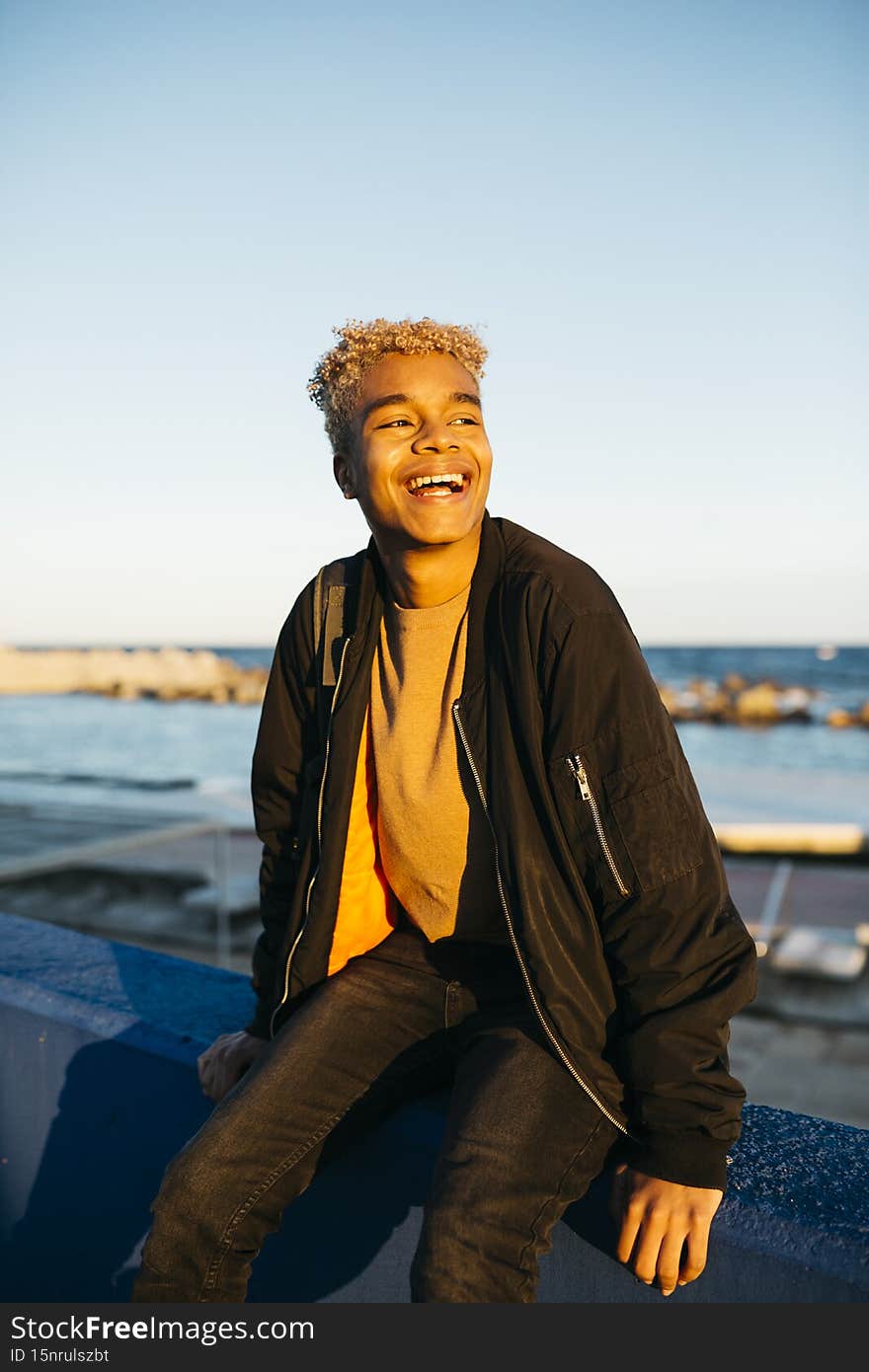 Portrait of a young latin american male walking on a urban scape. Portrait of a young latin american male walking on a urban scape