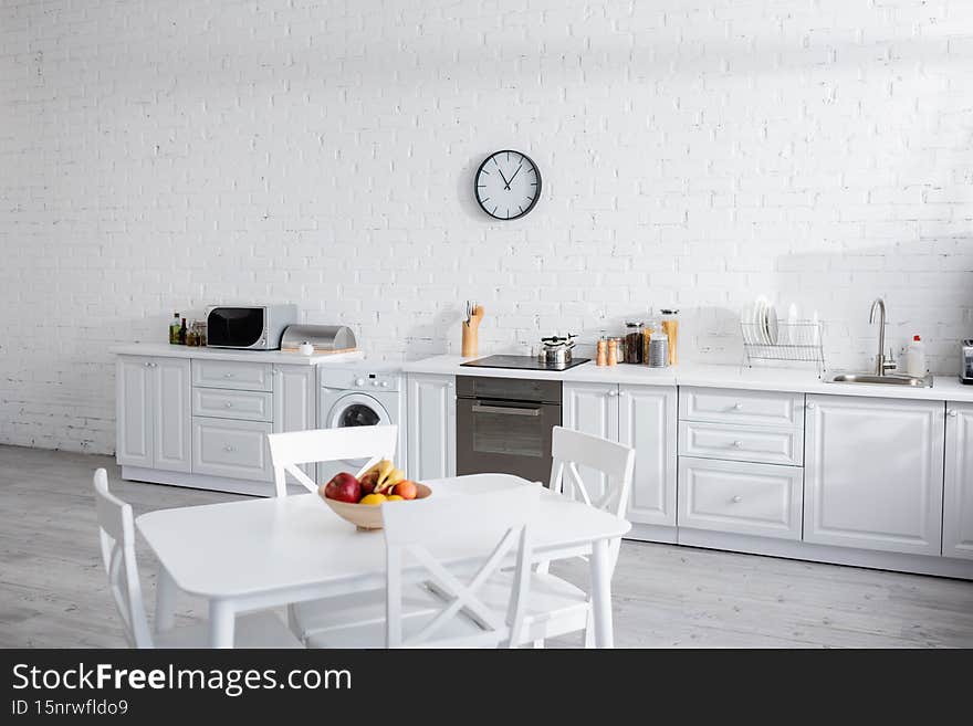 bowl with fresh fruits on white