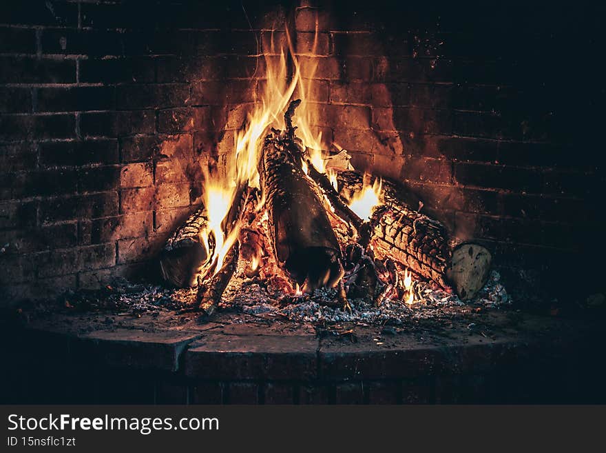 Wood burning fireplace, warm and cozy in cold weather outside the home. Wood burning fireplace, warm and cozy in cold weather outside the home