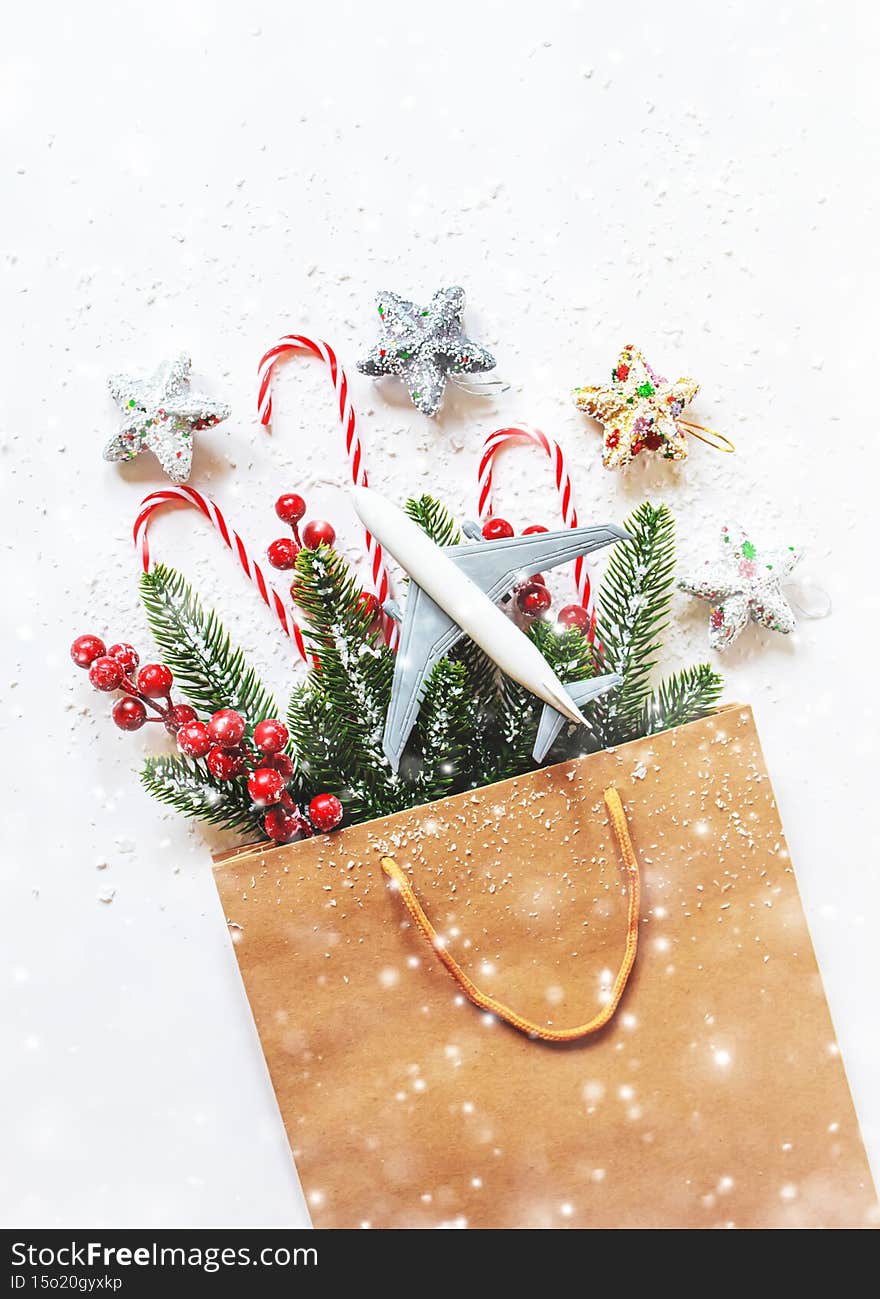 Travel for Christmas. Airplane with Christmas decor.New year.Selective focus.