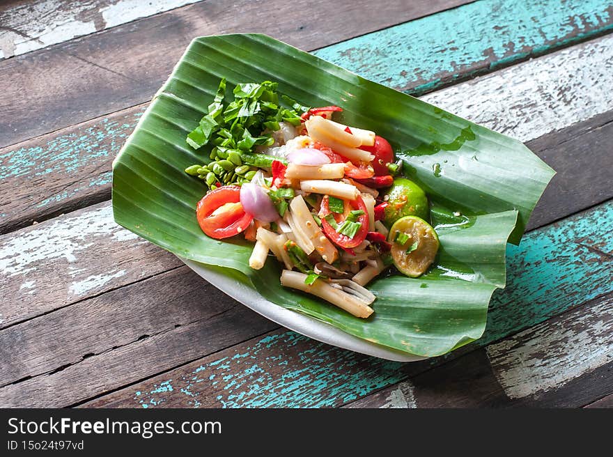 Top view of Thai style lotus stem spicy salad at Taling chan Floating market in Bangkok Thailand