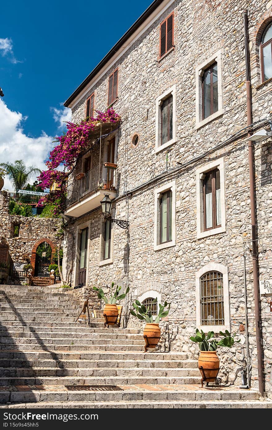 Typical Sicilian balcony in Taormina full of flowers and decorations