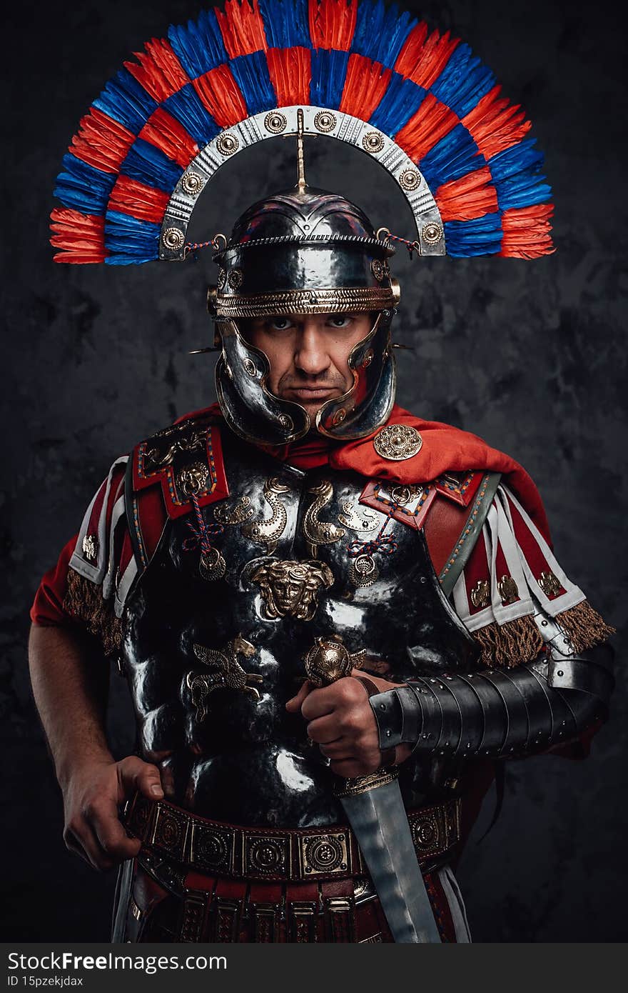 Portrait of ancient roman soldier dressed in armor with sword against dark background. Portrait of ancient roman soldier dressed in armor with sword against dark background.