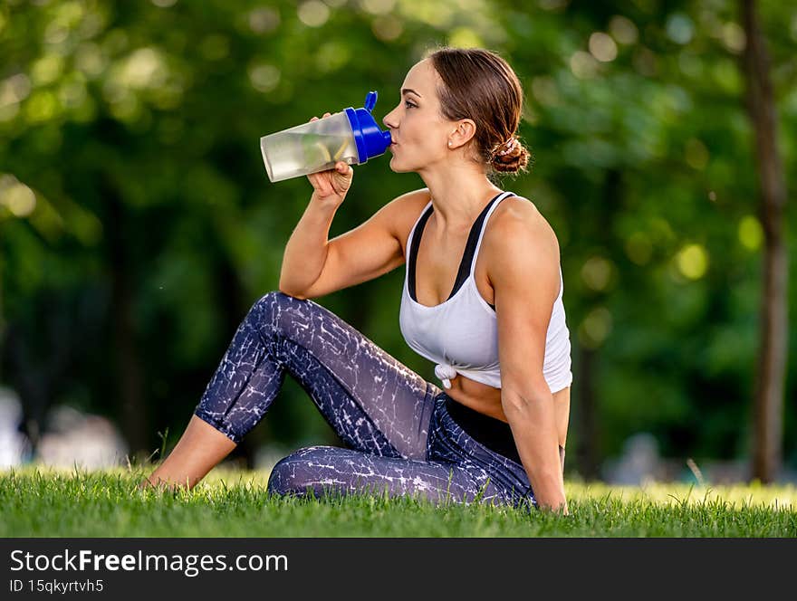 Girl with water during yoga
