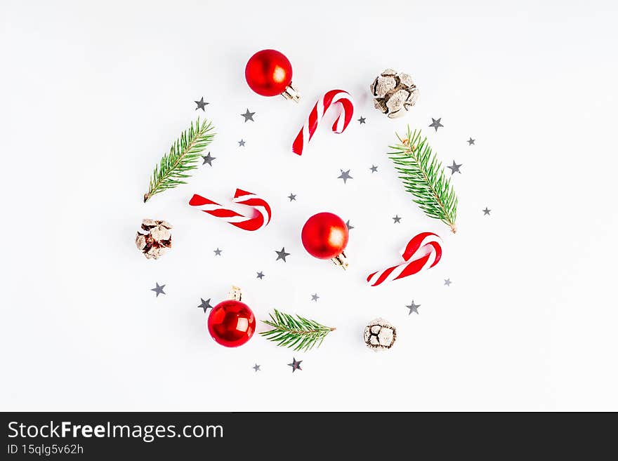 Christmas composition. Gifts, spruce branches, red decorations on a white background.New Year gifts.Christmas and New
