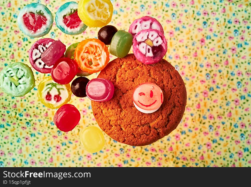 Multi-colored delicious lollipops. Various sweets. Candy and oatmeal cookies