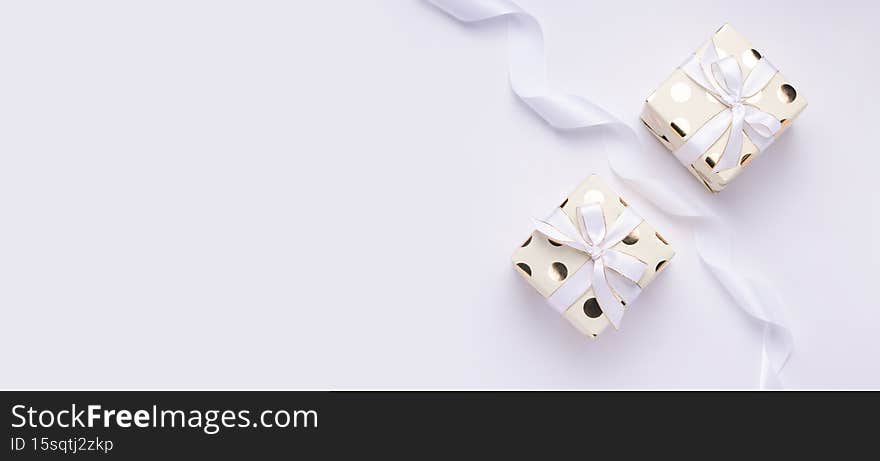 Holiday gift concept. Two packages on a white background. Copy space. Banner