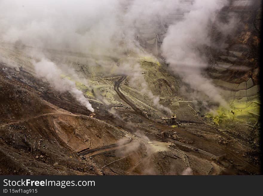 Egg-producing factory covered by sulphuric smoke in volcanic valley in Japan.