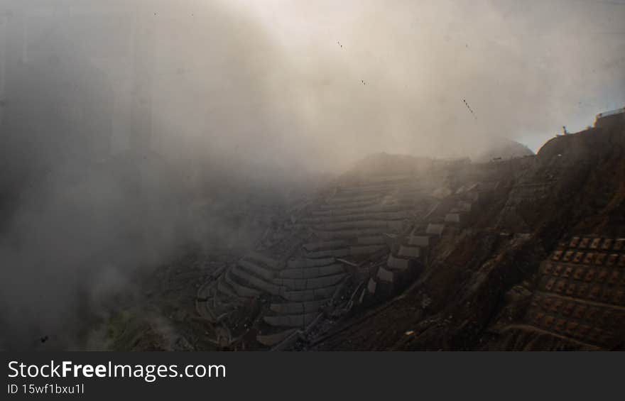 Egg-producing factory covered by sulphuric smoke in volcanic valley in Japan.