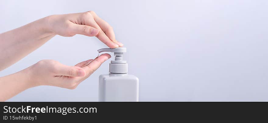 Washing hands. Asian young woman using liquid soap to wash hands, concept of hygiene to protective pandemic coronavirus isolated
