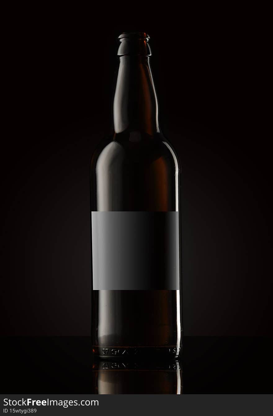Busta brown beer bottle on a dark background
