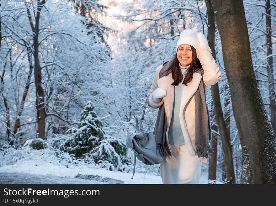 smiling woman walking by winter park copy space
